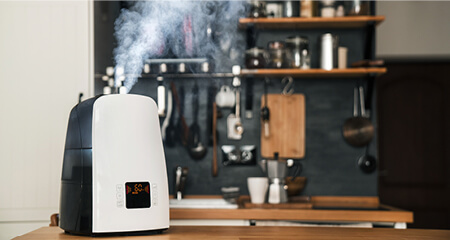 The humidifier distributes steam in the kitchen in loft style
