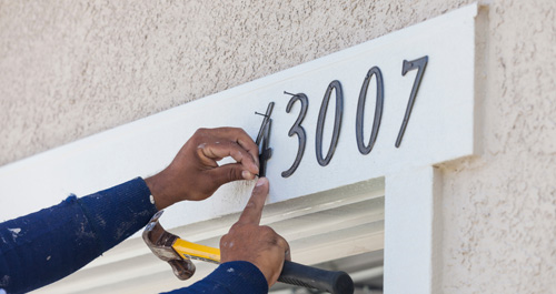 Mounting address numbers on front of home