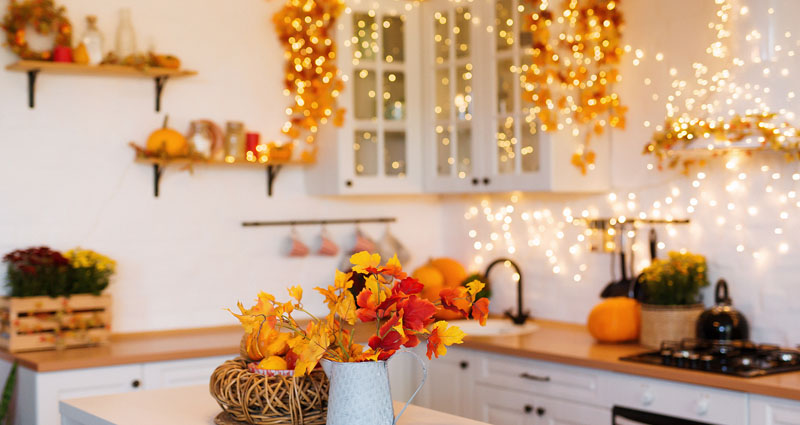 kitchen with fall decorations and lights