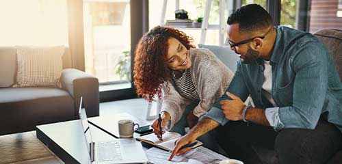 Young couple planning on laptop